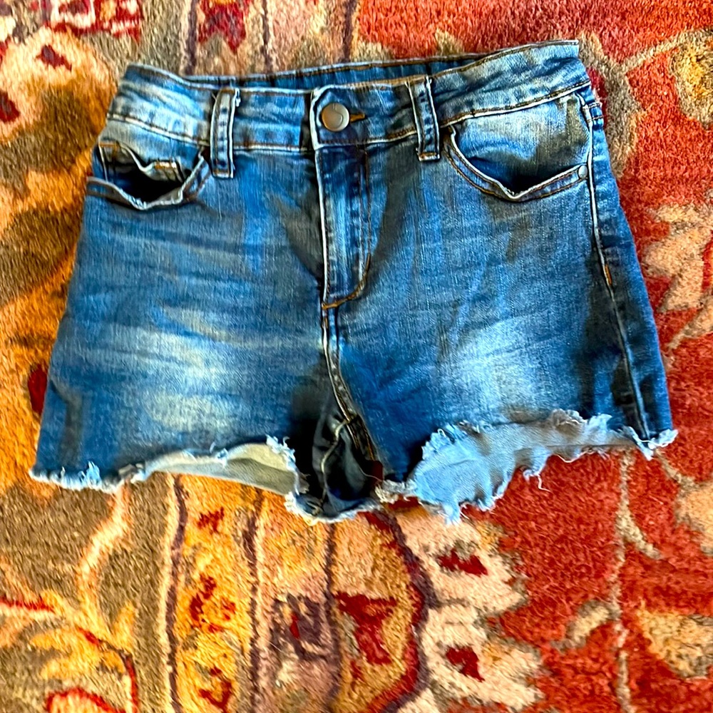 A pair of fringed shorts